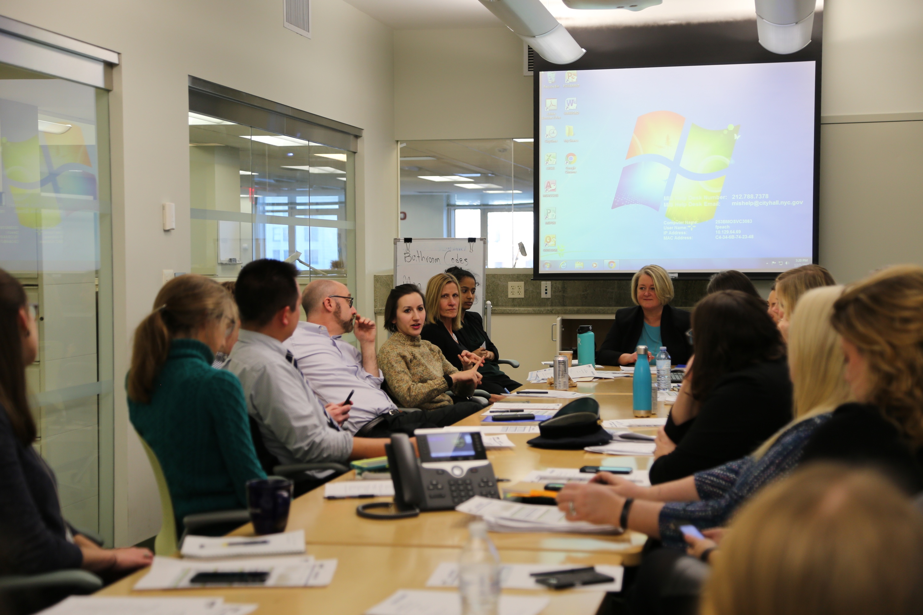 A photograph of a Vision Zero Task Force meeting in an office.
